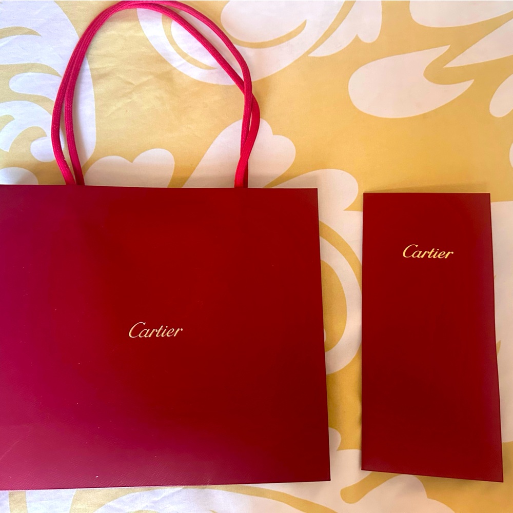 Cartier shopping bag and reciept folder.